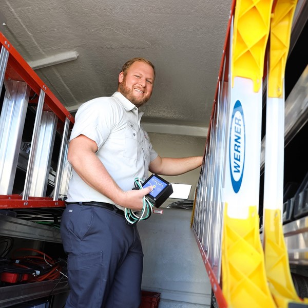 Brighter Day Electric Employee Removing Ladder from a Van in Port St. Lucie, FL