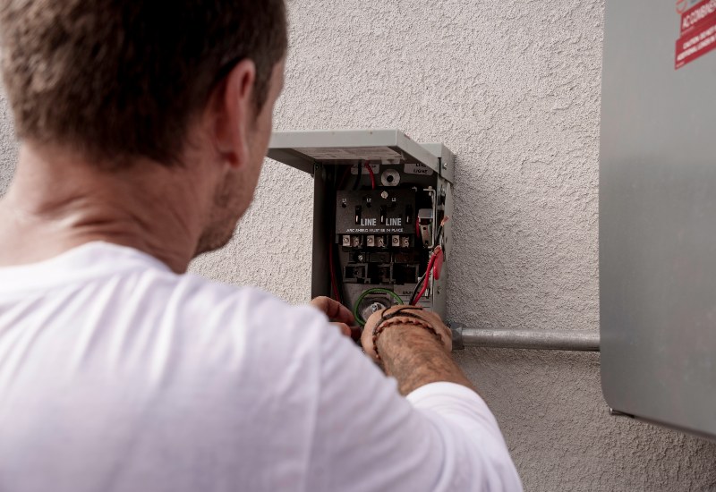Electrician Installing a New Hot Tub Electrical Switch in Port St. Lucie, FL