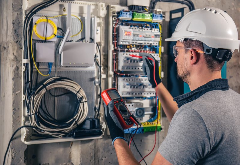 Electrical Technician Working in a Switchboard with Fuses in Port St. Lucie, FL